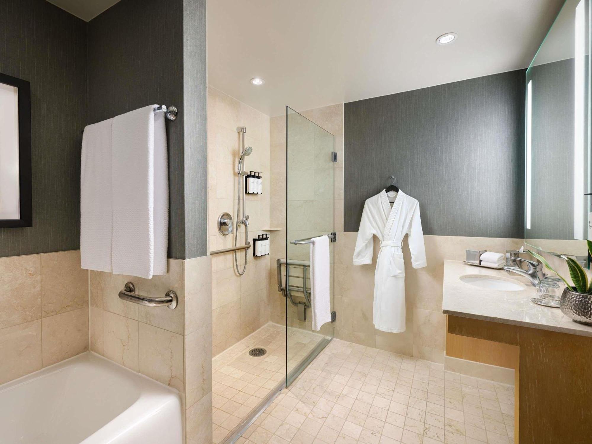 Corner King Suite Sofa Bed Accessible Tub Shower